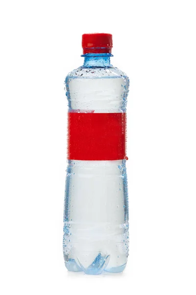 Um frasco de plástico com um rótulo vermelho — Fotografia de Stock