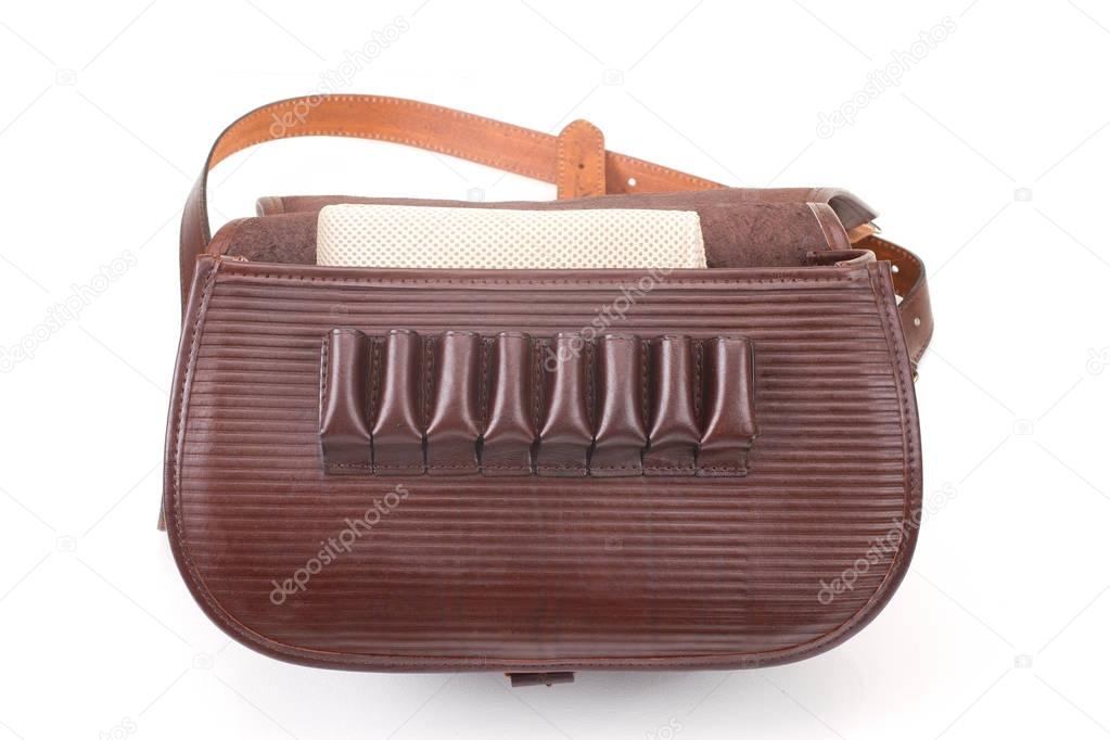 Leather hunting bag with brown ornament with patronage on white isolated background