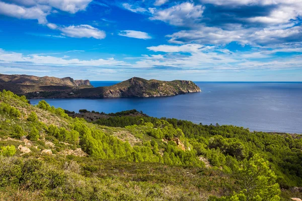 stock image Panoramic views of the sea and mountains, rocky and hilly terrain on the coast of Costa Brava, the Mediterranean Sea in Spain, Catalonia en route to the city of Cadaques. In summer with the weather