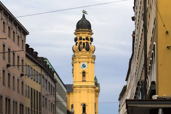 Feldherrnhalle and tower of theatinerkirche theatinerchurch at odeon square odeonplatz in munich city bavaria germany tower clock time detail portrait orientation — Stock Photo, Image