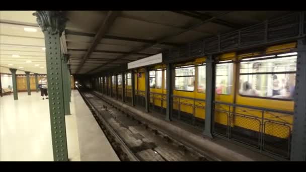 Budapest Hungary vintage old metro train stop underground. Yellow train in Budapest metro. Interior of metro station in Budapest. Subway Line 1. July 15, 2017. Hungary. Budapest — Stock Video