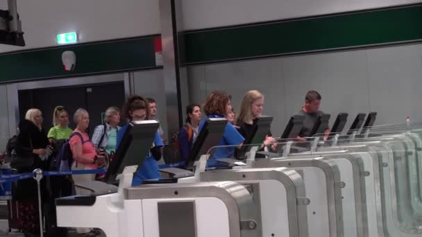 Air travelers pass through automated passport border control gates Milano Malpensa Airport. Electronic automatic passport check Italy border in Milan Malpensa airport. Italy Milan September 17, 2019 — Stock Video