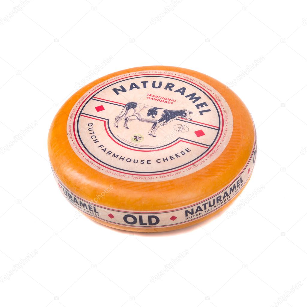 Cheese wheel isolated on white background. head cheese editorial isolate. round Italian cheese slabs in close-up. Ukraine, Kiev, December 6, 2019.