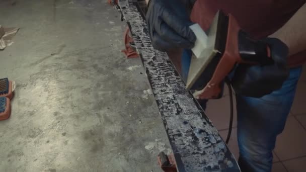 Applying hot wax to ski base with iron. Applying Ski Wax To Ski Base. Ski base tuning. Ski wax iron and wax bars. Ski service and repair. repairman in workshop ski service. Man Waxing Ski In Workshop — Stock Footage Applying hot wax to ski base with iron. Applying Ski Wax To Ski Base. Ski base tuning. Ski wax iron and wax bars. Ski service and repair. repairman in workshop ski service. Man Waxing Ski In Workshop Stock Video