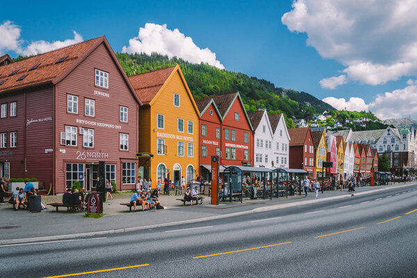 Bergen, Norway. View of historical buildings in Bryggen. Hanseatic wharf in Bergen, Norway July 28, 2019. UNESCO. Famous Bryggen street with wooden colored houses in Bergen Akerbrygge distric