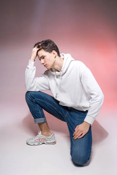 Pensive Teen Boy Posing Sitting Floor Studio Portrait Stylishly Dressed — Stock Photo, Image