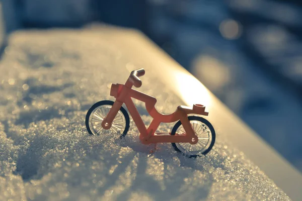 toy bike in the snow