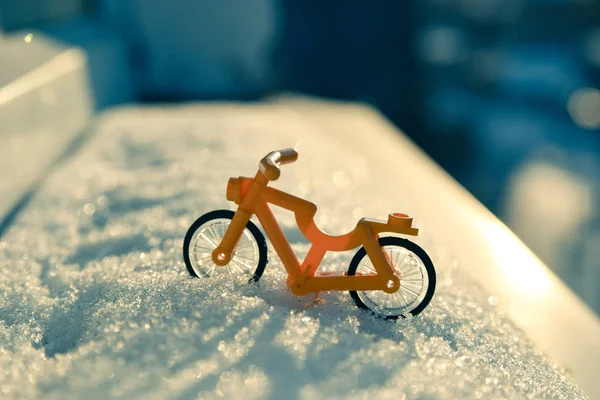 toy bike in the snow