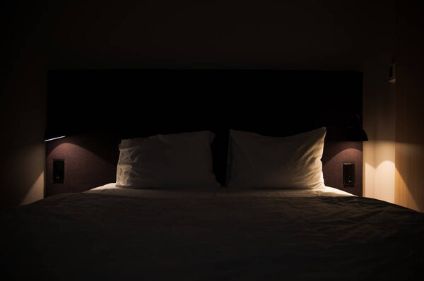 A big bed in a cozy hotel