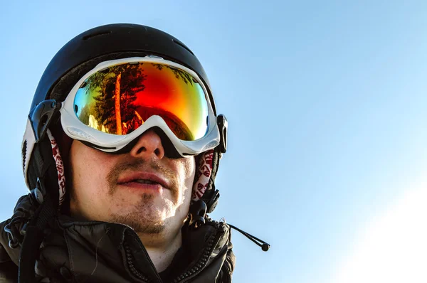 portrait of an athlete in a ski helmet and glasses