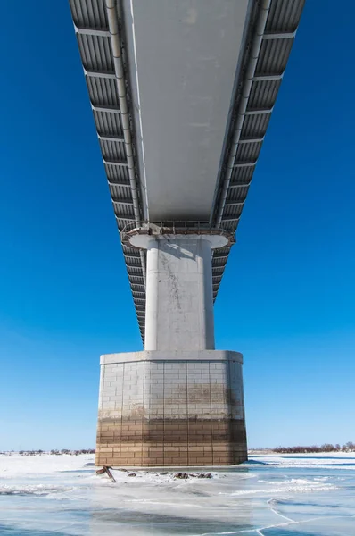 Support of an automobile bridge in a frozen river — Stock Image Support Automobile Bridge Frozen River Stock Image
