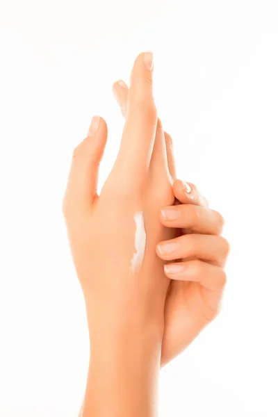 Close up das mãos da mulher com creme isolado no backgroun branco — Fotografia de Stock