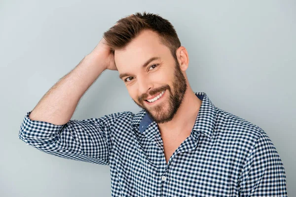 Happy handsome smiling man touching his hair — Stock Photo, Image