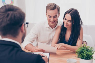 Successful lawyer giving consultation to family couple about buy clipart