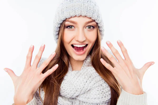 Cheerful woman  in warm hat and scarf gesturing with hands — Stock Photo, Image