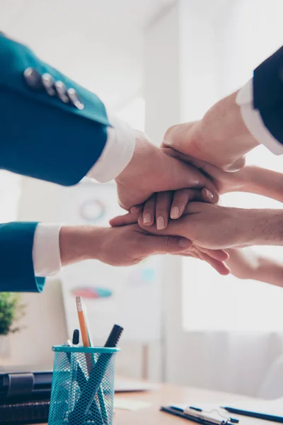 Close up of business people putting their hands on top of each o — Stock Photo, Image