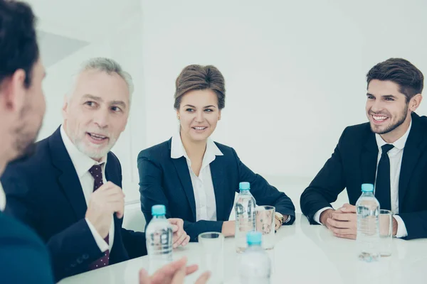 Business team studying new business plan in a meeting — Stock Photo, Image