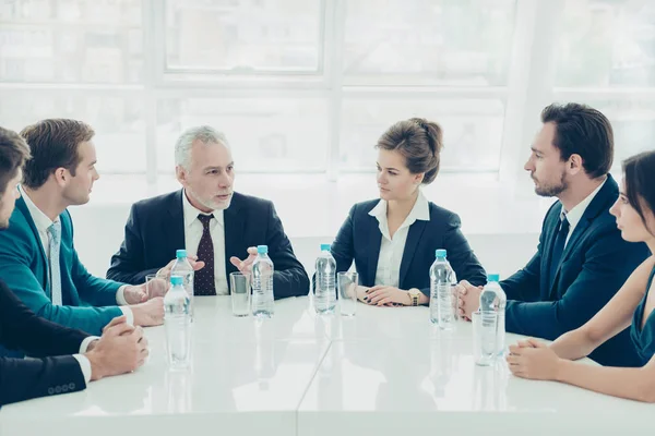 Group of colleagues planning future work at meeting in office — Stock Photo, Image