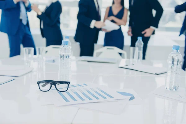 Close up of working place of young managers on business meeting — Stock Photo, Image