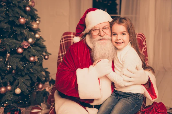 dream is real in christmastime! happy little cute girl sitting o