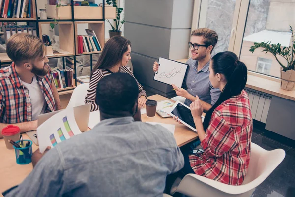 Young man presenting his ideas to colleagues on meeting — Stock Photo, Image