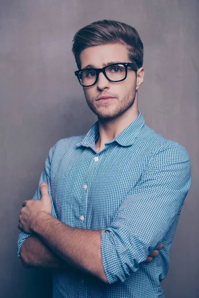 Confident young smart man in glasses with crossed hands — Stock Photo, Image