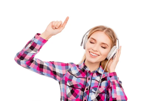 Happy music lover listening music in headphones and dancing Stock Photo