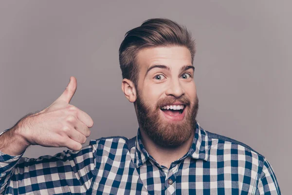 Young happy stylish bearded guy showing thumb up — Stock Photo, Image