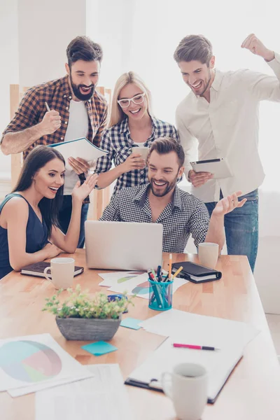 Great news! Happy smiling businesspeople triumphing with raised — Stock Photo, Image