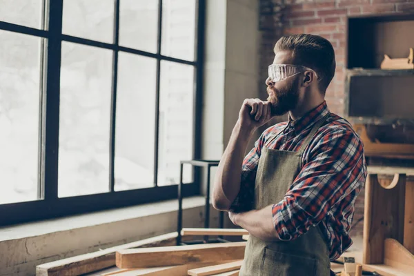 Successful handsome cabinetmaker look to the side at window. St — Stock Photo, Image