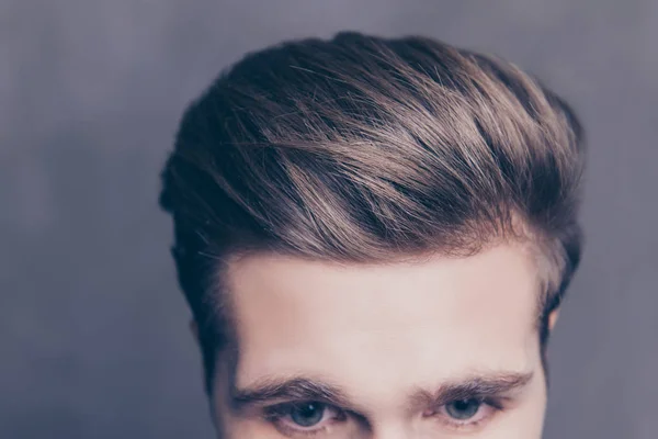 Close up photo of a young man's hair on gray background — Stock Photo, Image