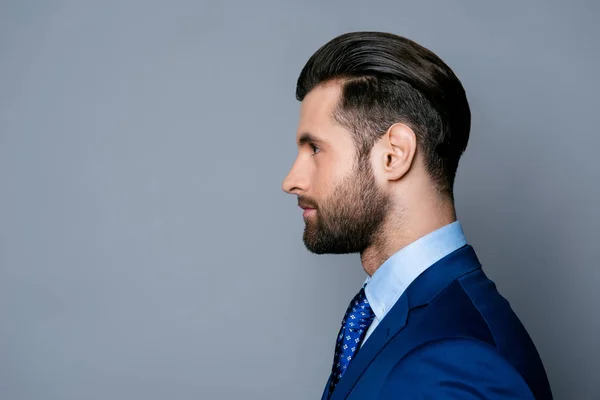 Side view portrait of serious fashionable handsome man in blue s — Stock Photo, Image