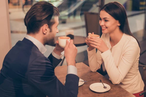 Portrait of lovely romantic couple sitting in a cafe with coffee — Stock Photo, Image