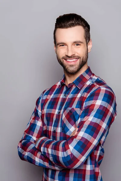 A semi portrait of handsome bearded smiling man in checkered shi — Stock Photo, Image
