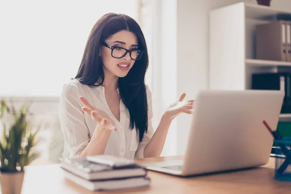 Close-up portrait of beautiful young businesswoman at a loss wit