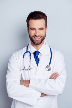 Vertical photo of cheerful smiling doc standing with crossed han clipart