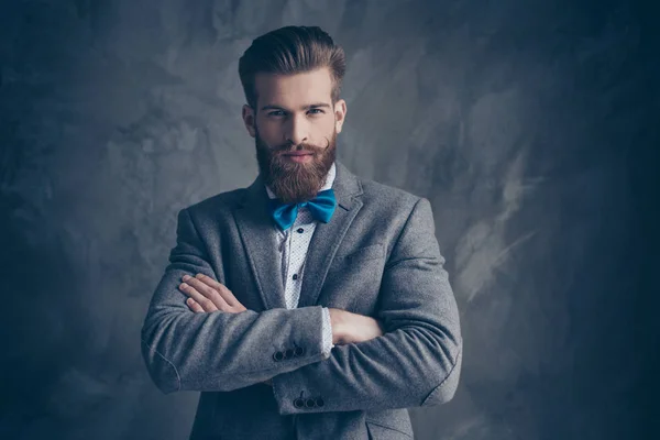 Portrait of serious young bearded man with mustache in a suit st — Stock Photo, Image