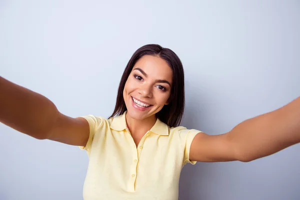 Close up portrait of cute excited latin girl making selfie with — Stok Foto