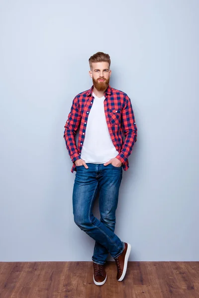 Successful young fashionable red bearded entrepreneur in bright