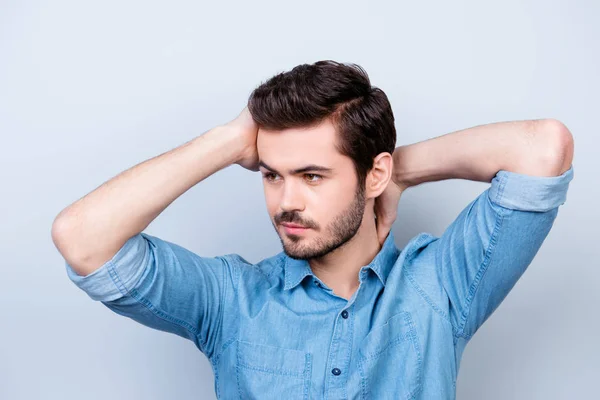 Close up portrait of confident brunet man touching his head and — Stock Photo, Image