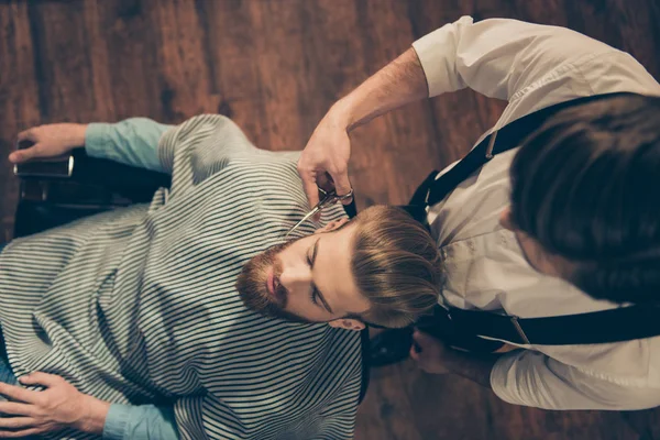 Top view of a red bearded handsome young man having his styling — Stock Photo, Image