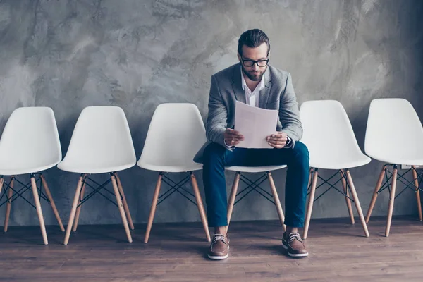 Serious bearded young man in glasses and formal wear is preparin — Stock Photo, Image