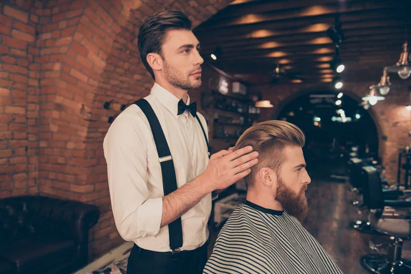 Side view of attractive classy dressed barber shop stylist, whic — Stock Photo, Image