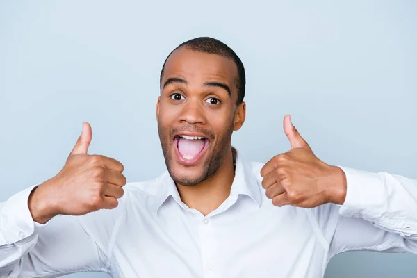 Cheerful successful african employer is showing thumbsup on a pu — Stock Photo, Image