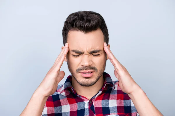 Head is blasting, strong migraine. Struggling handsome young man — Stock Photo, Image