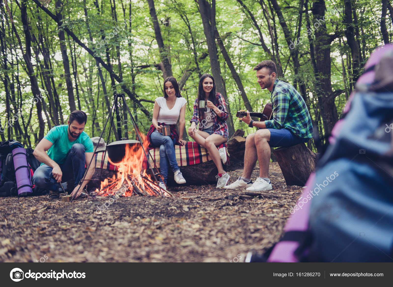 Trekking Camping And Wild Life Concept Four Best Friends Are Hiking In The Spring Woods Ladies Are Talking And Laughing All Are Excited And Anxious In Jungle Trail Stock Photo Image