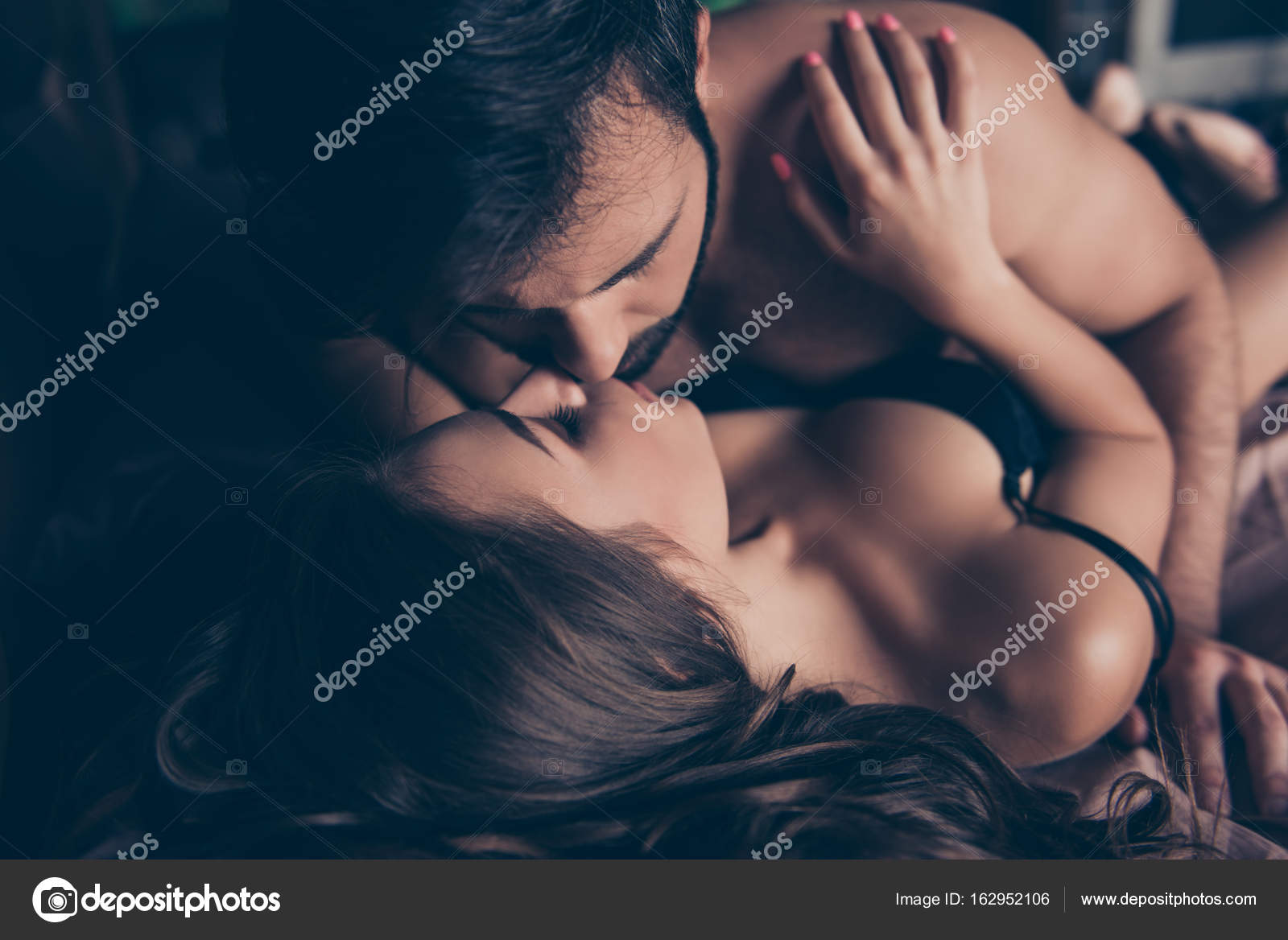 Beautiful half naked married young couple of attractive brunets Stock Photo by ©deagreez1 162952106