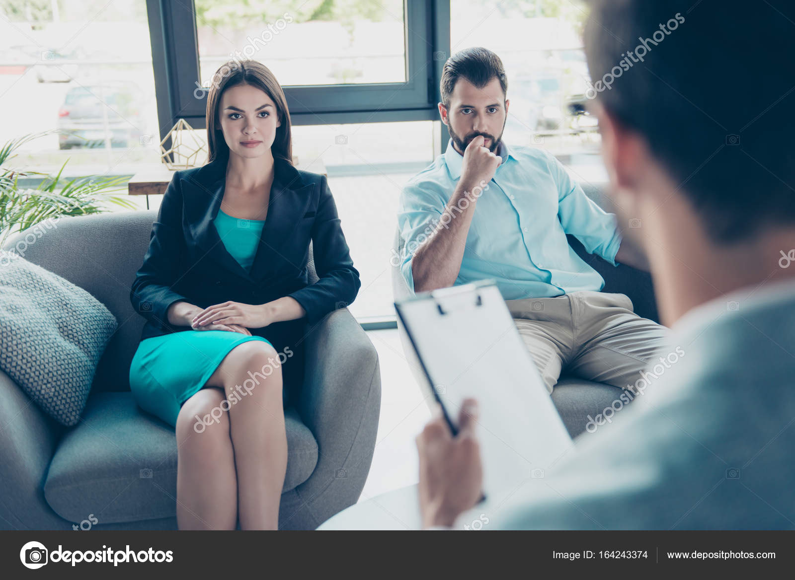 Serious couple is listening to their family doctor, concentrated Stock Photo by ©deagreez1 164243374