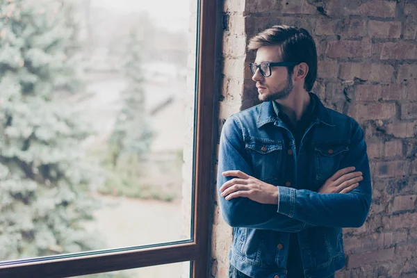 Portrait of young handsome guy with glasses and a jeans jacket i — Stock Photo, Image