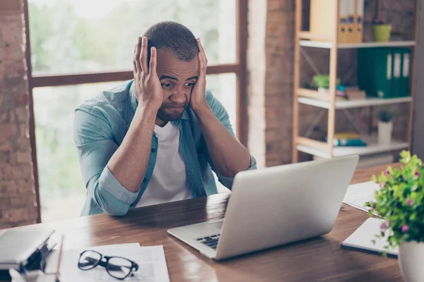 Frustrated young african entrepreneur with sad grimace in front — Stock Photo, Image